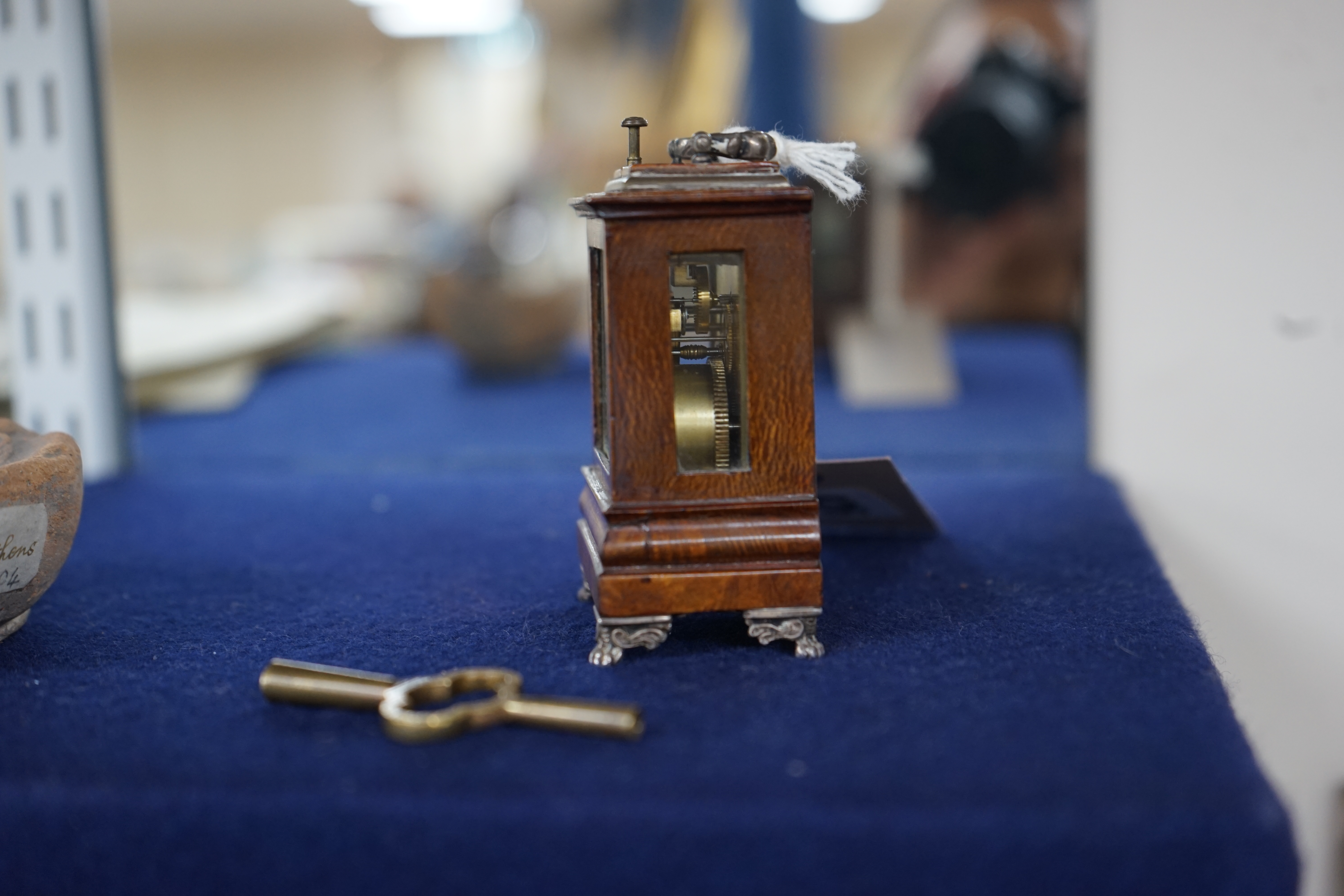 An early 20th century walnut miniature repeating carriage clock, with key, 8.5cm. Condition - fair, currently ticking